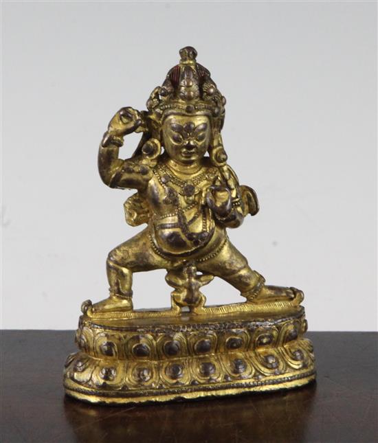 A Tibetan gilt copper bronze figure of Mahakala, 18th / 19th century, 10.5cm.